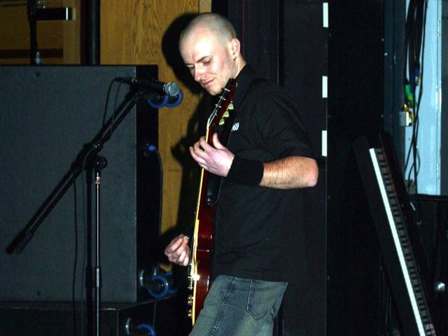 Alan Madden Amaroula getting to grips with the guitar at the Battle of the Bands 311/dd