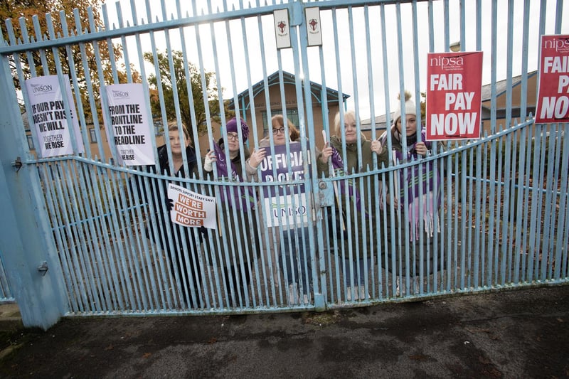 GATES CLOSED!. . . Office staff at St. Joseph's Boys School pictured on the picket line yesterday morning.