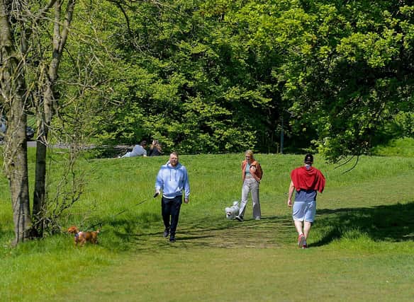 Locals enjoy a stroll in a picturesque St Columb’s Park. DER2120GS – 010