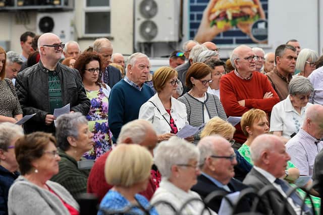 People gather for a service in Claudy marking the 52nd anniversary of the car bombings that killed nine people and injured 30 others. Photo: George Sweeney