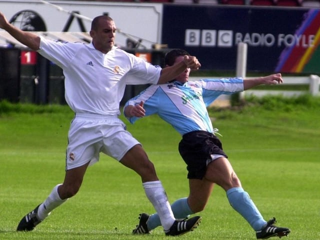 Eddie McCallion gets a tackle in on Carlos Aranda.