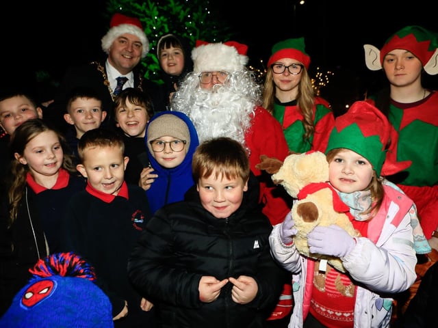 Children gather around the Mayor Ruairí McHugh, Santa and his elves at switch on the Christmas tree lights Strathfoyle Youth Forum.   (Photo - Tom Heaney, nwpresspics) : .
