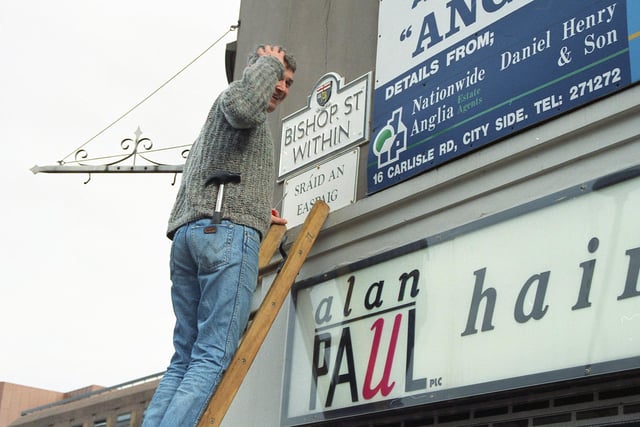 One of the first street signs in Irish being erected at Bishop Street Within in 1992.