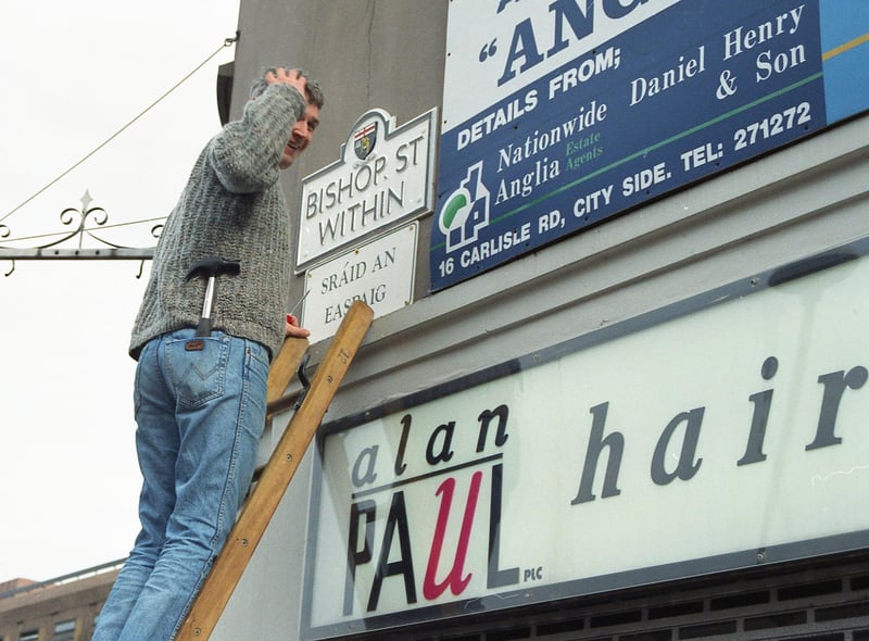 One of the first street signs in Irish being erected at Bishop Street Within in 1992.