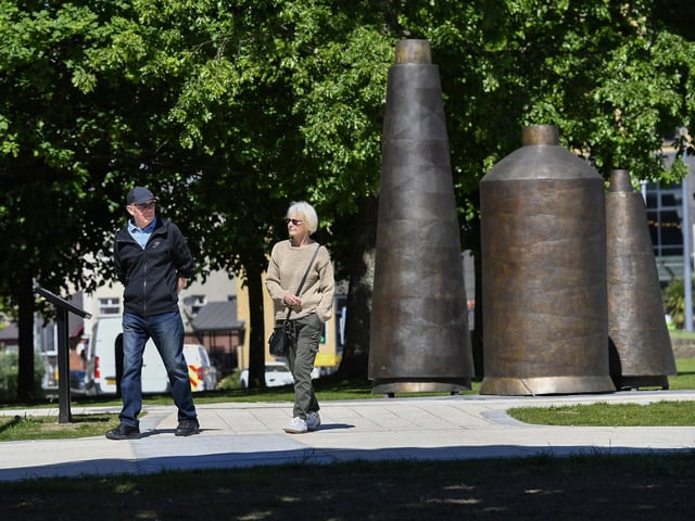 Strolling past the Factory Girls monument. Photo: George Sweeney
