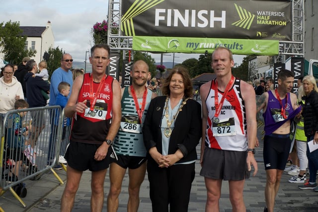 Mayor of Derry Cllr. Patricia Logue pictured with the front three male runners at the Waterside Half Marathon, Gavin McGlinchey, Kyle Doherty and Noel McNally.