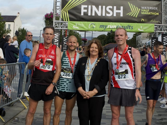 Mayor of Derry Cllr. Patricia Logue pictured with the front three male runners at the Waterside Half Marathon, Gavin McGlinchey, Kyle Doherty and Noel McNally.