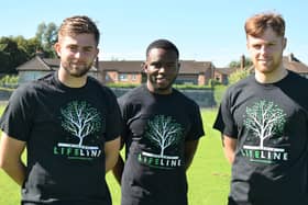 Derry City players Will Patching, James Akintunde and Cameron McJannet wearing the Lifeline Inishowen T-shirt.
