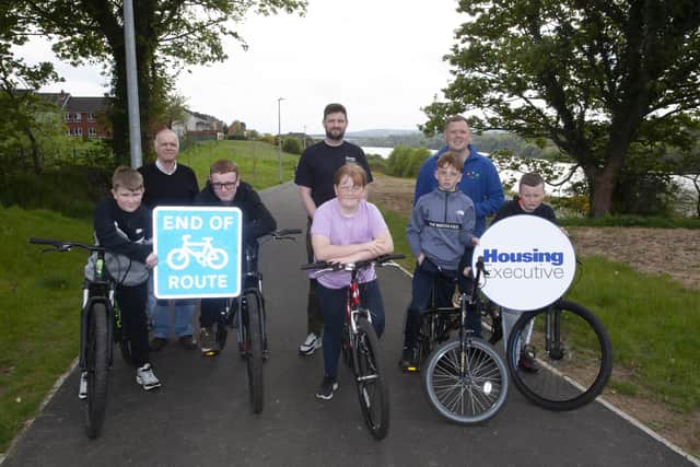 BIKE SAFETY WORKSHOP . . . . .Young people from the Strathfoyle area of Derry who took part in a Bicycle Safety Workshop organised by Enagh Youth Forum and funded by the Housing Executive, pictured enjoying the new Strathfoyle Greenway safely this week on their newly-mended bicycles. At back are from left, Eamonn O’Donnell, Enagh Youth Forum, Michael Cooke, Patch Manager, Housing Executive and Paul Hughes, Youth and Community Worker, Enagh Youth Forum. (Photos: Jim McCafferty Photography)