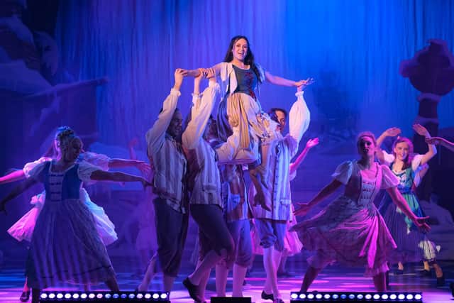Cinderella (Jasmine Gardiner) and members of the cast on stage at the Millennium Forum.