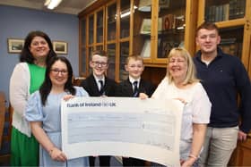 St. Columb’s College students and staff present a cheque for £3455.51 to the Patricia Hughes Bursary Scheme