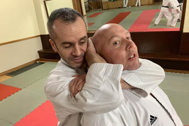 Aileach Karate Club instructor, Seamus Gillespie, performs a self defence demonstration with the help of clubmate Gareth Walker.