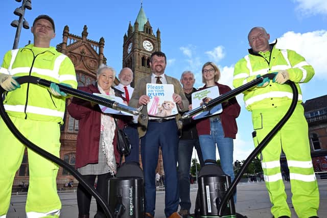 Derry City and Strabane District Council’s Street Cleansing team have launched a campaign to encourage people to dispose of their chewing gum properly. Pictured at the launch with Alderman Keith Kerrigan and specialist chewing gum cleaning team, Mark McConnell, left and Sam McDonald are, Marie-Elaine Tierney, District Officer Libraries NI, Alan Young, Translink, William Ferguson, DCSDC and Sarah Simpson, The BlackBird. Picture Martin McKeown. 10.09.24