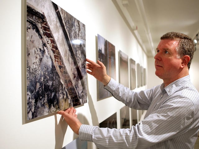 Derry artist Willie Doherty has been a pioneering figure in contemporary art film and photography for four decades. Exploring the relationship between landscape and memory, Doherty responds to mysterious isolated settings that conceal a troubled past. Doherty is pictured with his widely acclaimed previous art project, Apparatus.