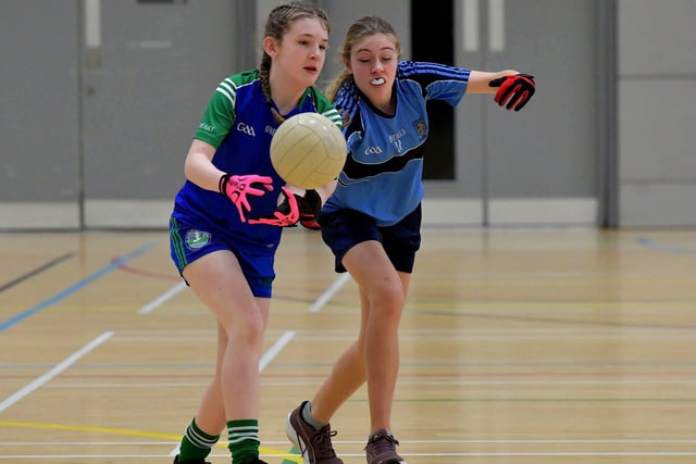 Sacred Heart and Hollybush battle for possession in the Derry City Primary School Girls’ Indoor Gaelic Football Finals Day at the Foyle Arena on Friday. Photo: George Sweeney. DER2308GS –124