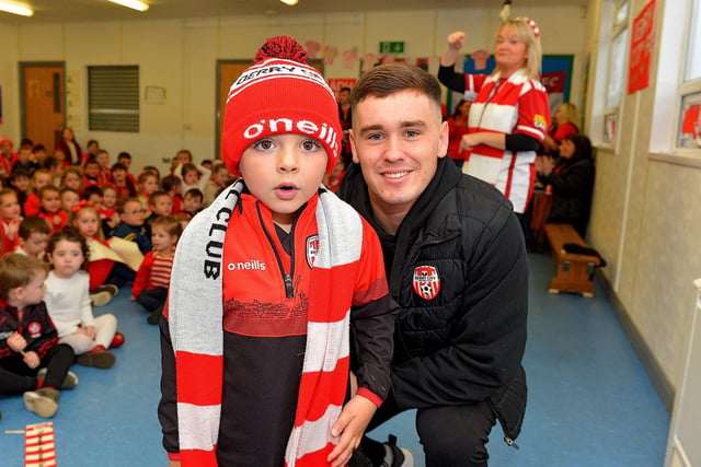 Gaelscoil Eadain Mohir pupil Aodhan singing ‘There’s only one Brian Maher’ during a visit by the Derry City goalkeeper Brian Maher on Friday. Photo: George Sweeney  DER2244GS – 21