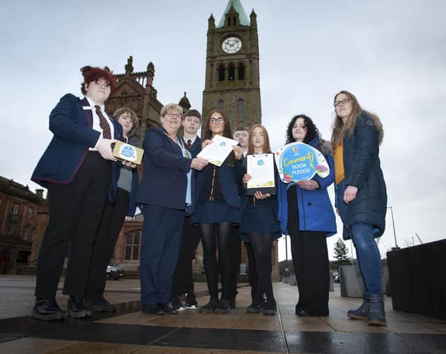 The Deputy Mayor of Derry City and Strabane District Council, Angela Dobbins endorsing the Oakgrove Integrated College Community Book Pledge when she met some of the students and teaching staff at Guildhall Square on Friday morning last. The students then called to local businesses in the city for sponsorship with the aim to collect £1,000 for the school to go towards books for the library. This will be added to by Usborne with an additional £600 of free books for the school. (Photos: Jim McCafferty Photography)