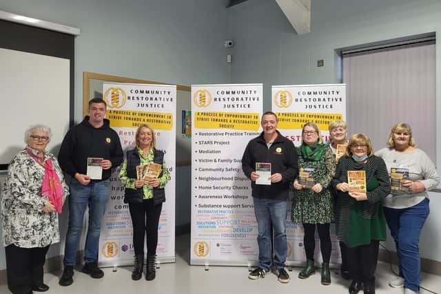 Galliagh Women’s Group at a scam awareness workshop delivered by CRJ staff Eamon Mc Ginley (left) and Mickey Anderson (right).