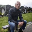 Paul Weller pictured at the graveside of Eamon Friel during his visit to the city on Wednesday afternoon. (Photos: Jim McCafferty Photography)