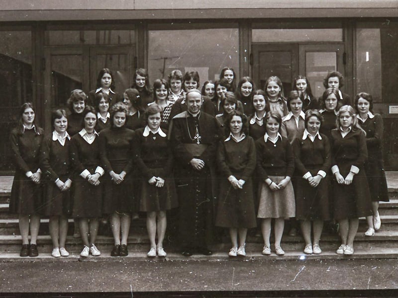 Bishop Edward Daly with prefects from St Cecilia's College, where he visited and held a special Mass for pupils and staff.