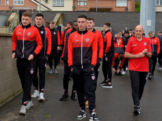 Derry City players and staff on their way to greet fans gathered at Brandywell Stadium on Saturday morning prior to their departure for Dublin ahead of tomorrow’s FAI Cup Final against Shelbourne. George Sweeney. DER2244GS – 35