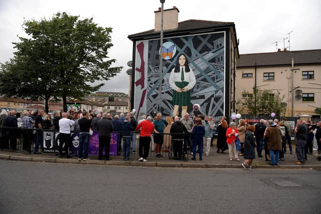 2021: People gather at a vigil at the ‘Death of Innocence’ mural in the Bogside commemorating the 50th anniversary of the killing of 14 year old Annette McGavigan, who was shot dead by a British soldier on 6th September 1971. Photo: George Sweeney. DER2136GS – 074