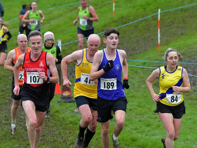 Spartans Andrew Maguire (107) and Foyle Valley’s Darragh Norrby (189) competing in the Spartans open cross country 6k race at Thornhill College on Saturday. Photo: George Sweeney
