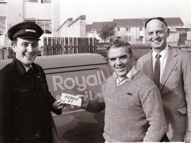 Postman delivering Kebele 37 envelopes to Jim Crossan, City Man.