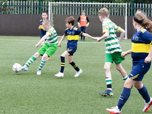 Action from one of the group games between Top of the Hill Celtic and Don Boscos.