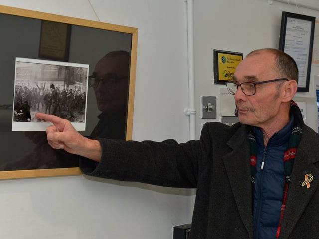 Liam Wray points to his brother Jim in a photograph at the Bloody Sunday, The Day Innocence Died' Exhibition in the Eden Place Arts Centre, Pilots Row Community Centre on Monday evening last. The exhibition will be on display until Monday 31st January next. Photo: George Sweeney. DER2204GS – 004