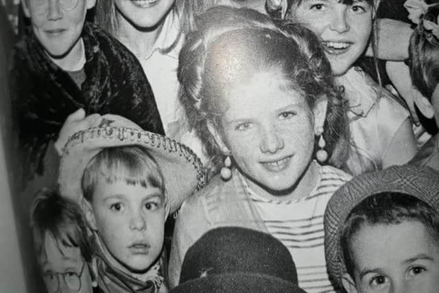 A very young John Harkin, bottom left sporting a cowboy hat with his identical twin sisters pictured behind him. John says this picture was taken at a children’s party in the former St Patrick’s Hall on Spencer Road in the 1960s.