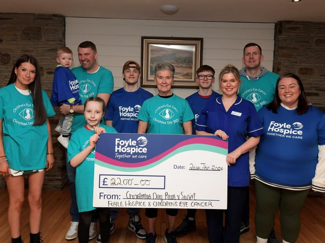 Deirbhile Logue, from the Foyle Hospice, and Roisin Lynch, Children’s Eye Care, receive a cheque from from Hallie McAdams, sponsorship proceeds from the Christmas Day Run and Swim at Ludden beach. The money was raised by members of the McAdams and Nicell families, who completed the run and swim. The families donated the £2,200 raised between the two charities, Foyle Hospice and Children’s Eye Care. Photo: George Sweeney