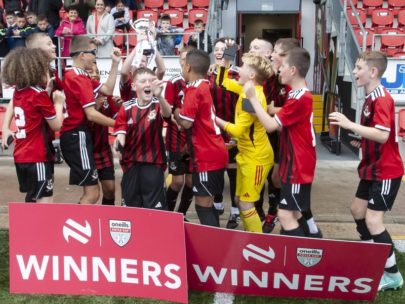 Crusaders celebrate their victory at the Brandywell.