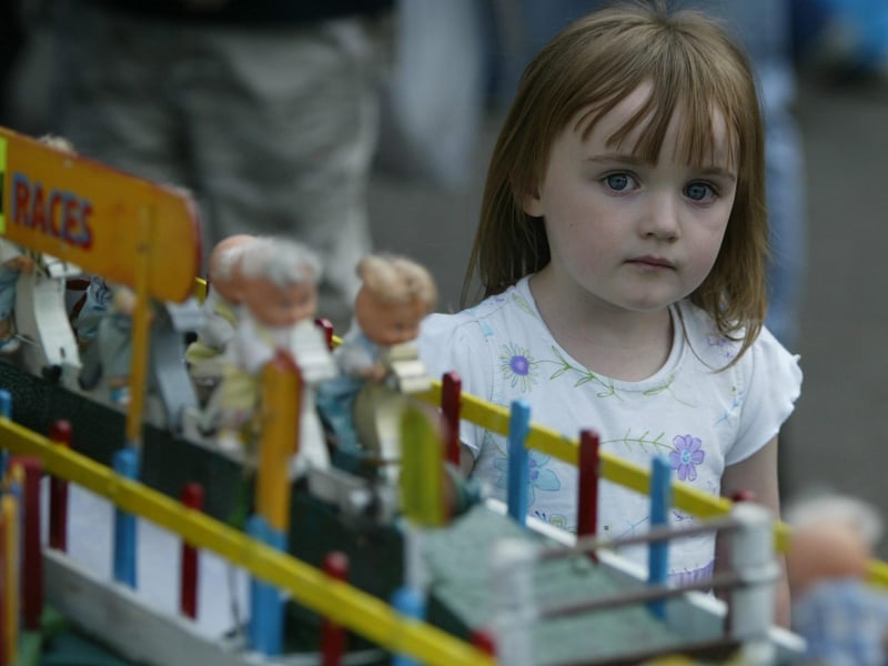 3 year old Brionnínn Cannon admires the miniature carnival at the Strabane Hiring Fair festival. (0107JB87)