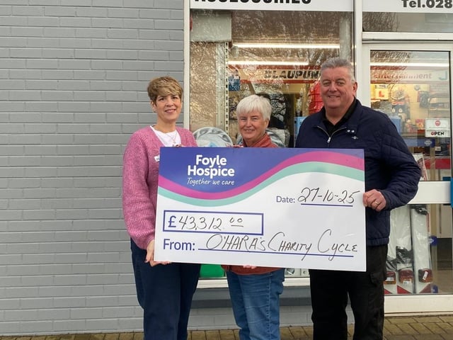 Jim O’Hara & Winifred O’Kane, presenting a cheque for £43,312, to Sheila Duffy, Foyle Hospice, proceeds from the `North Coast Cycle Challenge.’