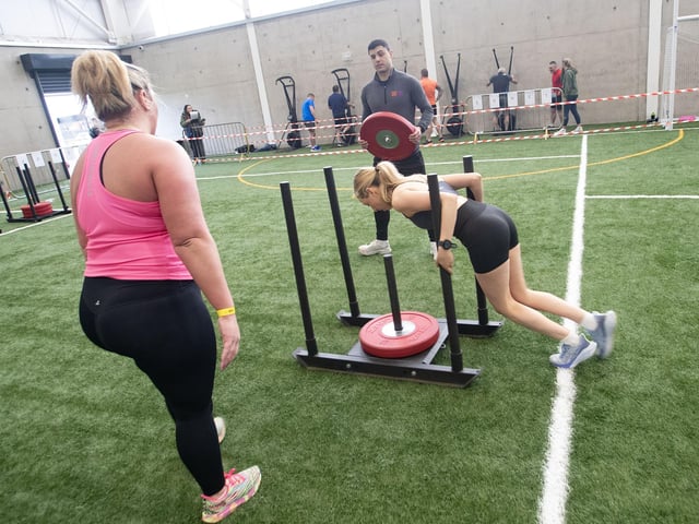 Danni O'Donnell and Kerrie Watercamp show off their strength duriing Sunday's Tri-Rox event.