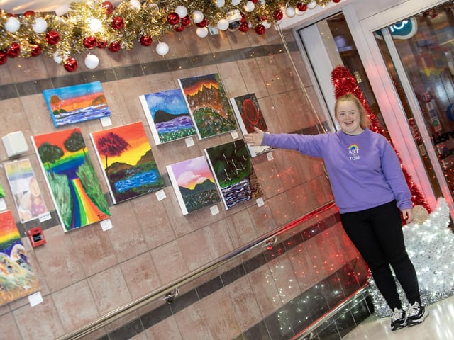 Artist Tori shows off some of her artwork at the entrance to the Lisnagelvin Shopping Centre on Wednesday afternoon. (Photos: Jim McCafferty Photography)
