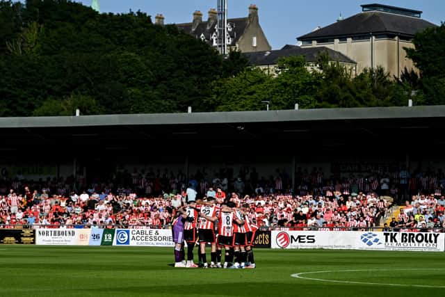 Derry City players huddle in front of a large Brandywell attendance during their last European home game against CSKA Sofia at The Ryan McBride Brandywell Stadium.