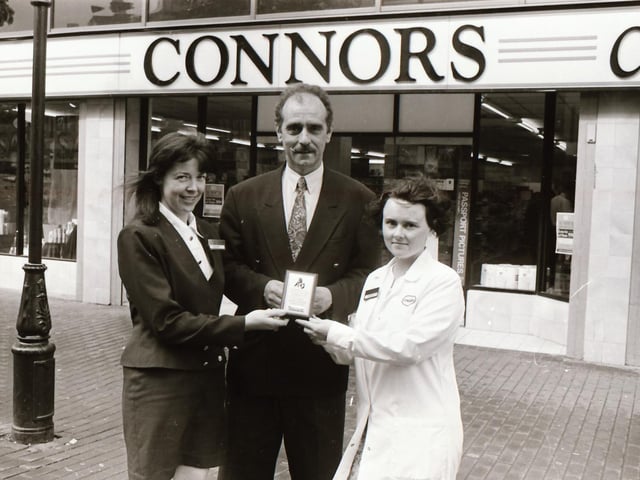 Connors Chemist presenting a cheque towards the Romania Appeal.