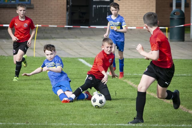 A battle for possession between Newell Academy and Aileach FC on Saturday afternoon. (Jim McCafferty Photography)