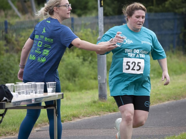 Alanna Ferry (525) takes on some water after finishing her first lap on Sunday.