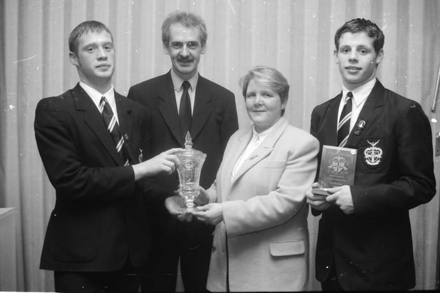 Mrs. Joan Skeffington, Board of Governors, presenting the Niall O'Kane Memorial Prize for Social Concern to Francis O'Kane, at the St. Columb's College prize-giving. Included are Mr. Des Kelly, Head of Middle School, and Paul Kearney (Six Years Full Attendance).