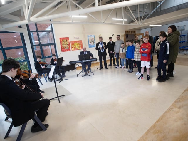 Mr. Donal Chamber's group of prospective pupils and their parents take time out to listen to Mr. Kerrigan and his Traditional Band at Saturday's St. Columb's College Open Day. (Photos: Jim McCafferty Photography) : .