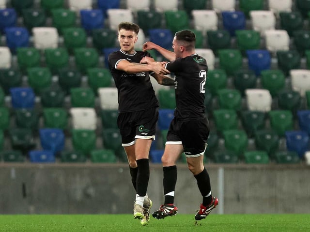 Ardmore's Eoin McKeever congratulates goalscorer Jack Coyle during Friday's fonaCAB Craig Stanfield Irish Junior Cup final at Windsor Park. (Photo: IFA)
