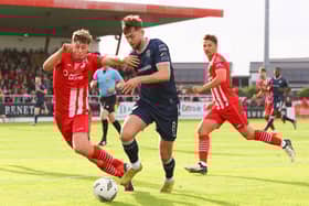 Will Patching gets on the ball against Sligo Rovers at the Showgrounds.