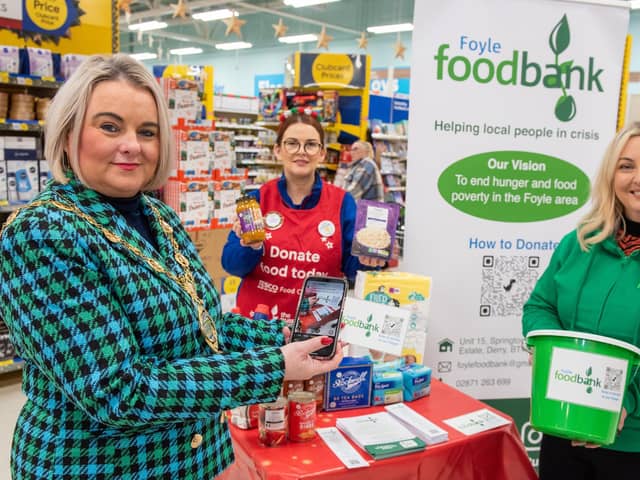 DECEMBER: Mayor Sandra Duffy at the launch of the Tesco Food Drive in Quayside with Karen Mullan, Foyle Foodbank and Fionnuala O’Reilly, Tesco Community Champion. Picture Martin McKeown. 01.12.22