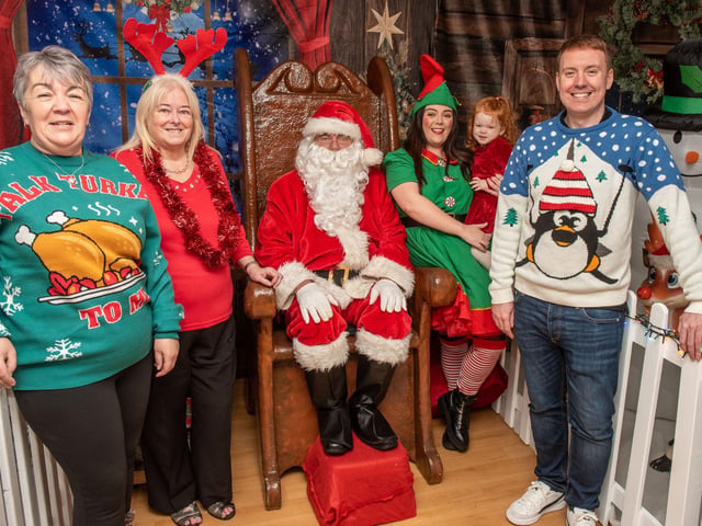Getting festive in Caw…Welcoming Santa at the Caw/Nelson Drive Action Group’s Crescent Community & Cultural Centre is Andy Mullan, Housing Executive Good Relations Officer, with 3 year old Scarlett, her mum Rachel, her granny Joanna and Linda Watson BEM, centre co-ordinator. This special Santa’s Grotto experience was funded by a Housing Executive Community Cohesion grant which enabled local families to meet Santa, get professional Christmas photographs taken and also ensured that every child went home with a present to put under the tree.