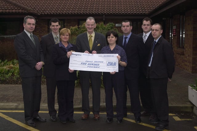 Dr Tom McGinley receiving a cheque for the Foyle Hospice from Musgrave representatives.