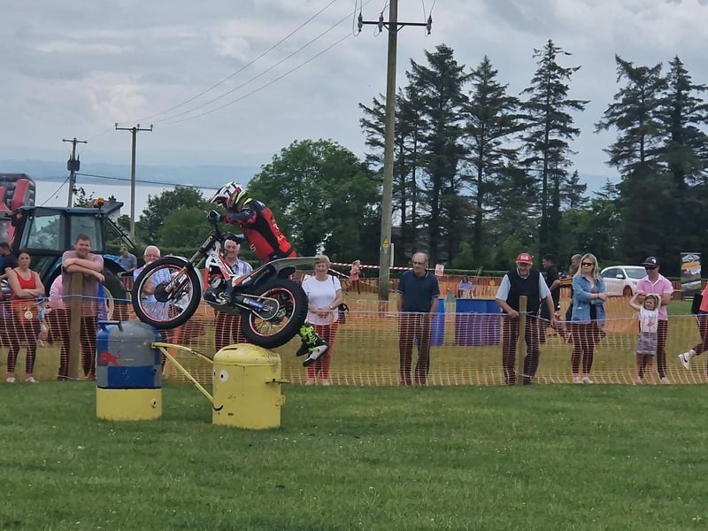 Impressed spectators watch as bikers from Trailstar Bikes show off their moves.