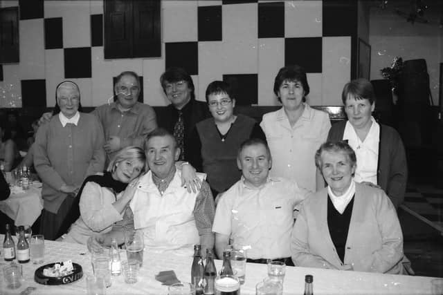 Enjoying the St. Eugene's Parish Hall Christmas dinner and dance in 2000.